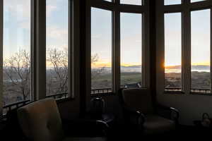 Sitting room with healthy amount of natural light and a mountain view