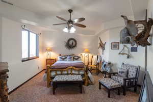 Bedroom with carpet and a ceiling fan