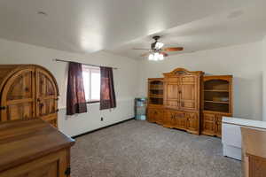 Bedroom featuring light colored carpet and ceiling fan