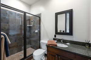 Bathroom with vanity and a shower stall