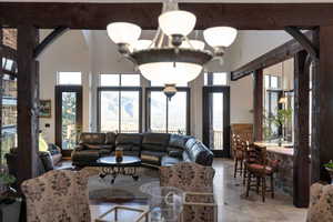 Living area featuring a high ceiling and arched walkways