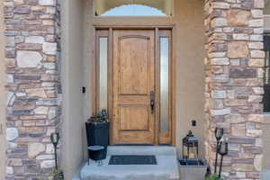 Property entrance with stone siding