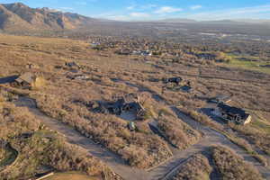 Aerial view of residential area featuring a mountainous background