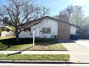 View of front of home featuring a chimney