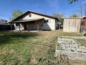 Back of property with a garden and a patio area