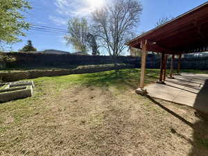 Fenced backyard featuring a patio area