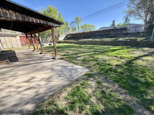 Fenced backyard featuring a patio