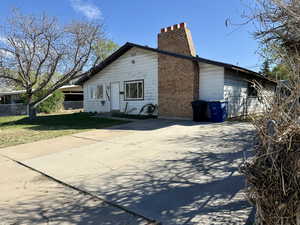 View of front of house with a chimney
