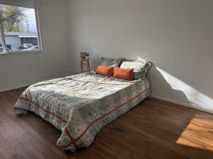 Primary Bedroom with dark wood-style floors