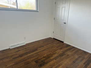 Bedroom 2 with hardwood floors.
