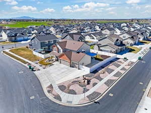 Aerial view of residential area featuring a mountainous background