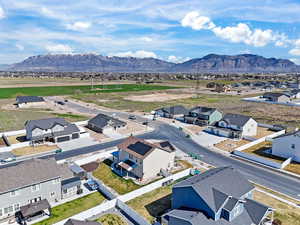 Aerial view of residential area featuring mountains