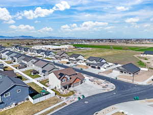 Aerial view of residential area featuring a mountainous background