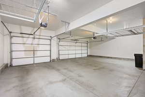Garage featuring a garage door opener