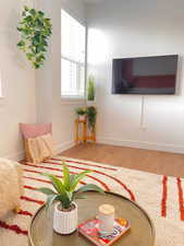 Living room with light wood finished floors and baseboards