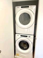 Laundry area with stacked washer / dryer