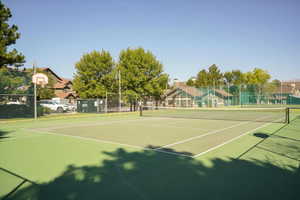 View of tennis court featuring community basketball court