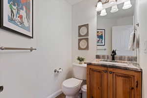 Bathroom featuring vanity and toilet