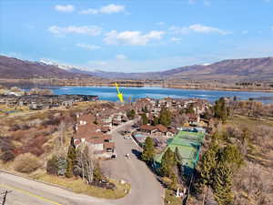 Aerial perspective of suburban area featuring a water and mountain view