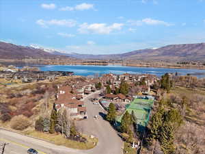 Aerial perspective of suburban area with a water and mountain view