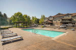 Community pool featuring a patio and a gazebo