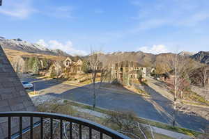 View of mountain backdrop featuring nearby suburban area