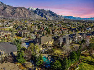Aerial perspective of suburban area with a mountain backdrop