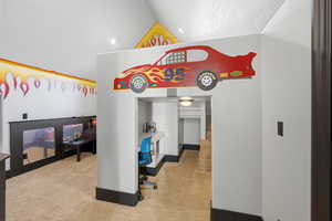 Bedroom featuring light colored carpet and vaulted ceiling