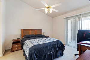 Bedroom with light carpet, lofted ceiling, a ceiling fan, and access to outside