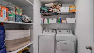 Laundry room featuring washer and clothes dryer