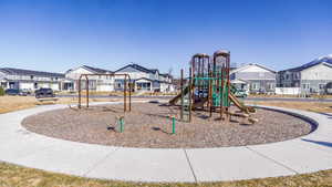 Community jungle gym featuring a residential view
