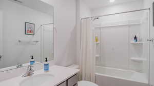 Full bathroom featuring vanity and shower / tub combo