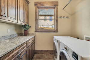 Laundry area with washer and dryer and cabinet space