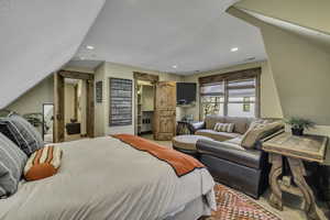 Bedroom with recessed lighting and lofted ceiling
