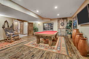 Game room with billiards, hardwood / wood-style floors, and recessed lighting