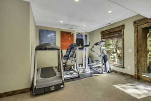 Workout area with recessed lighting and carpet