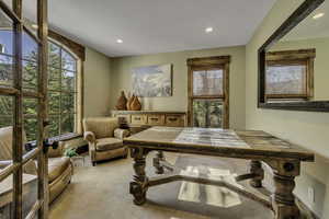 Carpeted dining room featuring recessed lighting and a textured ceiling