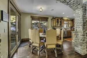 Dining space with dark wood finished floors and a textured ceiling