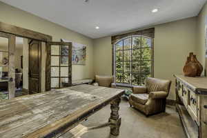 Office featuring light colored carpet and recessed lighting