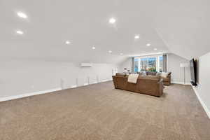 Living room featuring light carpet and recessed lighting