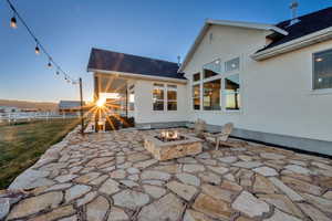View of patio / terrace featuring an outdoor fire pit
