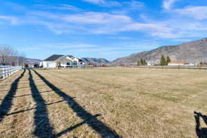 View of yard with a mountain view and a view of rural / pastoral area