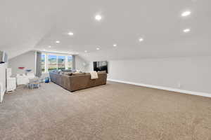 Living room with recessed lighting and light carpet