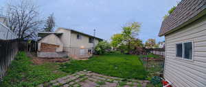 Fenced backyard featuring a patio area