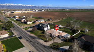 Aerial perspective of suburban area featuring a mountainous background