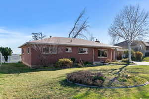 Back of property featuring brick siding