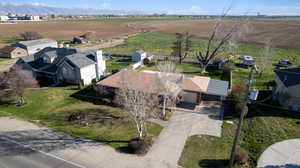 Overview of rural landscape featuring large plots for crops