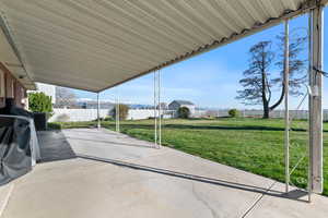 View of patio featuring a grill