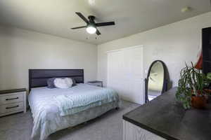 Bedroom with light carpet and ceiling fan