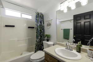 Full bath with vanity and shower / bathtub combination with curtain